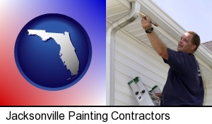 Jacksonville, Florida - a painting contractor brushing paint on an aluminum leader