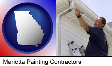 a painting contractor brushing paint on an aluminum leader in Marietta, GA