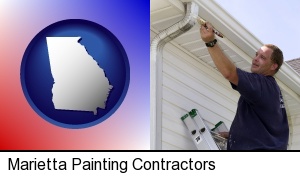 Marietta, Georgia - a painting contractor brushing paint on an aluminum leader