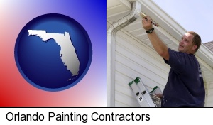 Orlando, Florida - a painting contractor brushing paint on an aluminum leader