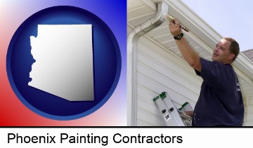 a painting contractor brushing paint on an aluminum leader in Phoenix, AZ