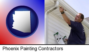 Phoenix, Arizona - a painting contractor brushing paint on an aluminum leader
