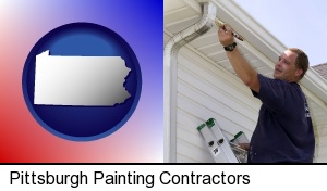 a painting contractor brushing paint on an aluminum leader in Pittsburgh, PA