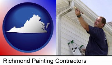 a painting contractor brushing paint on an aluminum leader in Richmond, VA