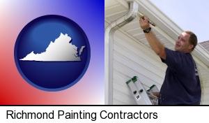 Richmond, Virginia - a painting contractor brushing paint on an aluminum leader