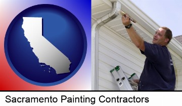 a painting contractor brushing paint on an aluminum leader in Sacramento, CA