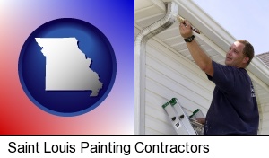 Saint Louis, Missouri - a painting contractor brushing paint on an aluminum leader