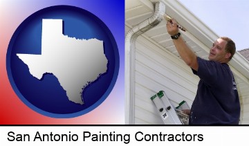a painting contractor brushing paint on an aluminum leader in San Antonio, TX