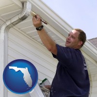 florida map icon and a painting contractor brushing paint on an aluminum leader