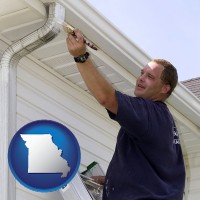 missouri map icon and a painting contractor brushing paint on an aluminum leader