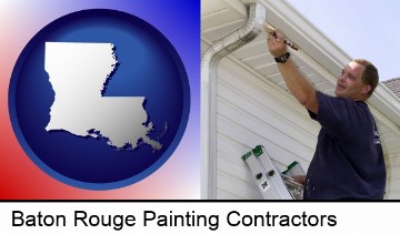 a painting contractor brushing paint on an aluminum leader in Baton Rouge, LA