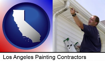 a painting contractor brushing paint on an aluminum leader in Los Angeles, CA