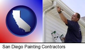 San Diego, California - a painting contractor brushing paint on an aluminum leader