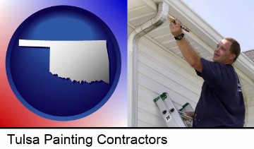 a painting contractor brushing paint on an aluminum leader in Tulsa, OK